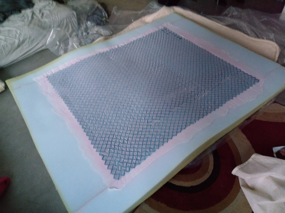 Picture of opened intellibed bed topper with gel in middle and foam around edge